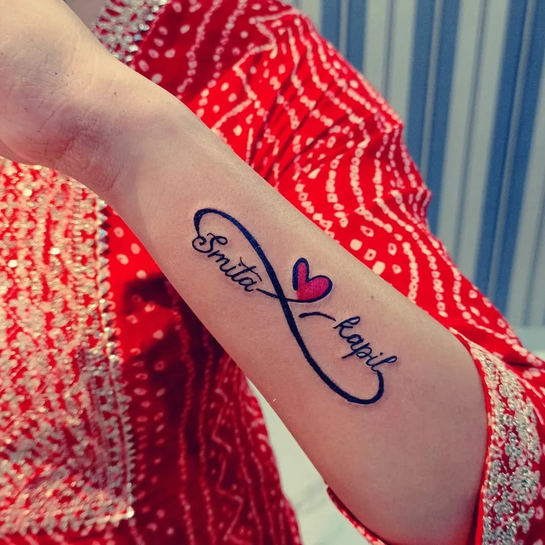 Simple cursive name tattoo 