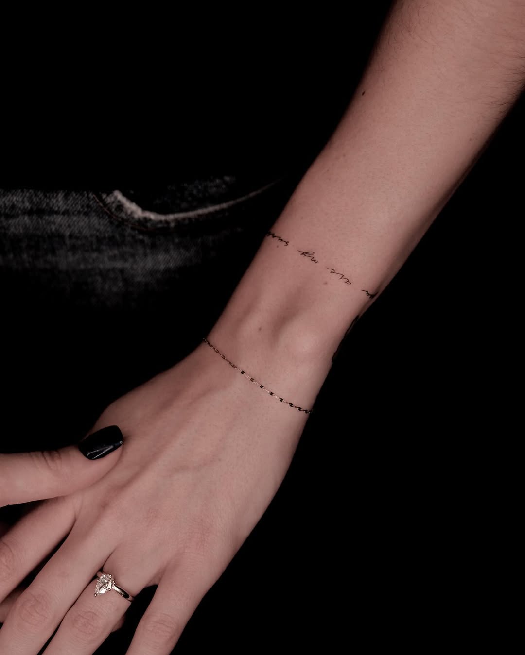 Single-line bracelet tattoo